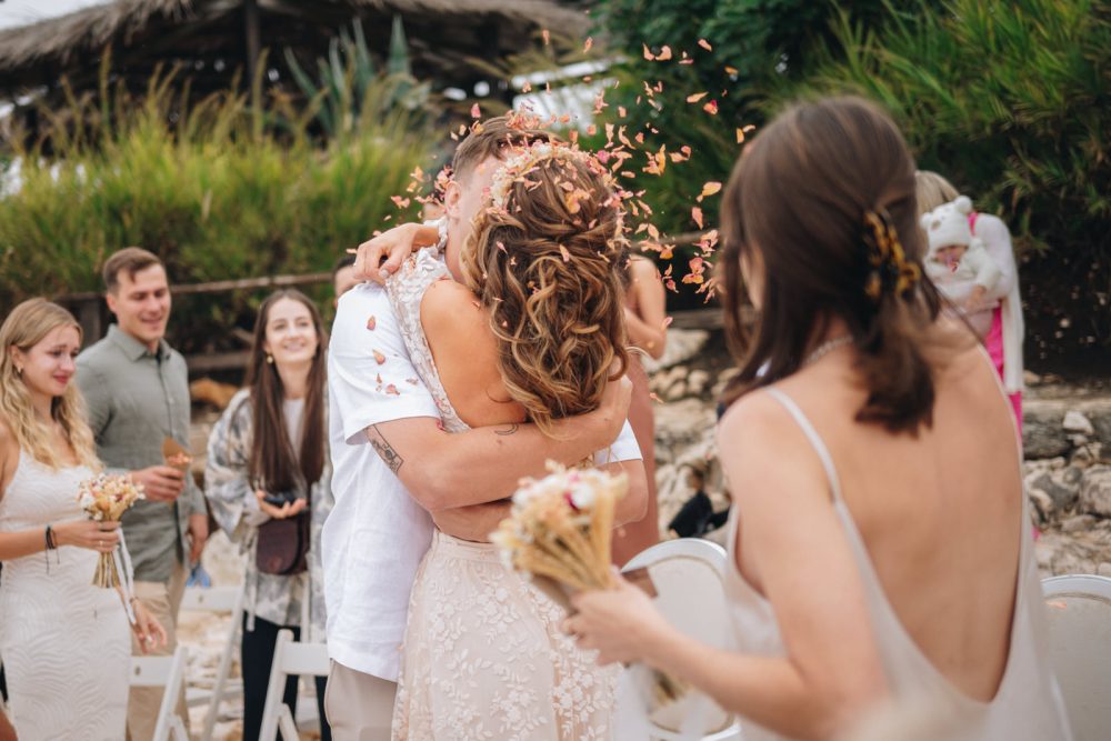 Newlyweds celebrating after wedding ceremony on Levan Island in Istria