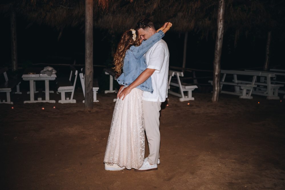 Bride and groom dancing at night on Levan Island in Istria