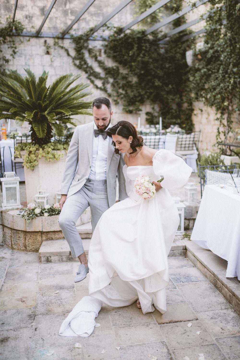 Bride and groom breaking glass at the San Giorgio Hotel in Vis