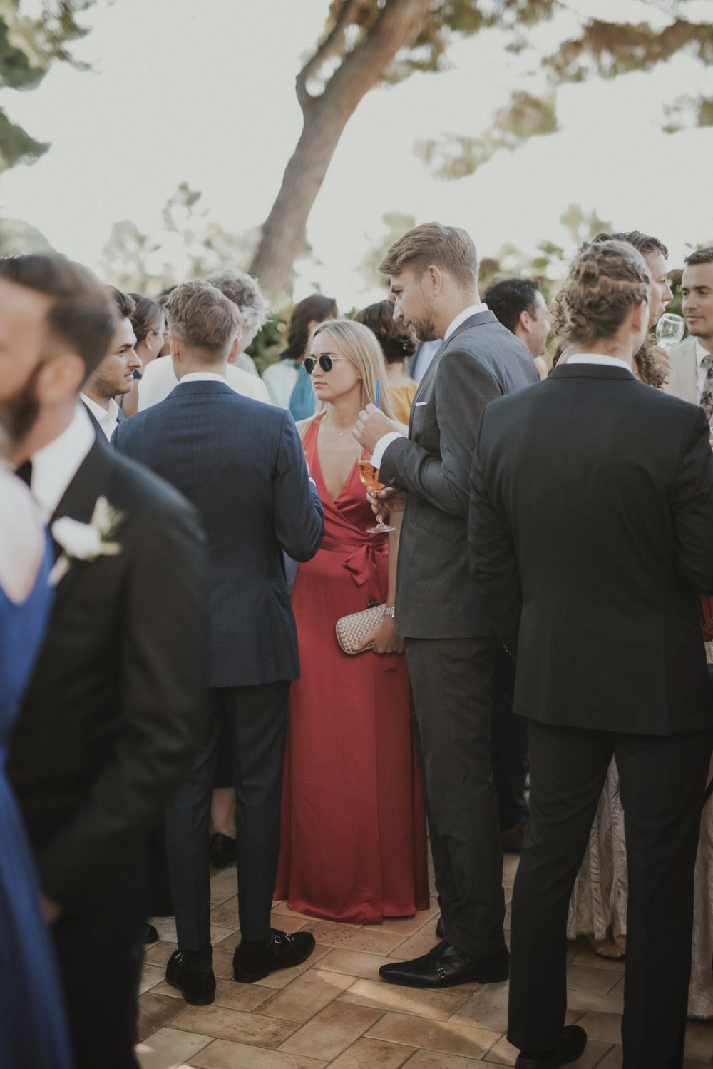 Guests mingling and enjoying cocktails at an elegant outdoor reception at Martinis Marchi Castle, Croatia