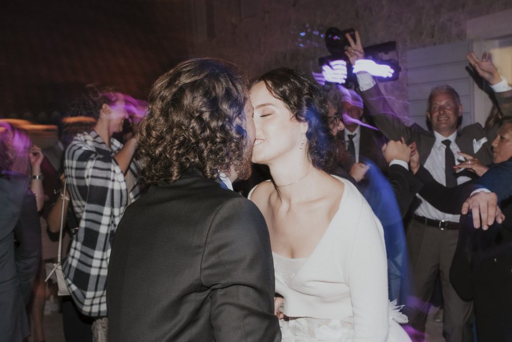 Bride and groom kissing at Martinis Marchi Castle captured by Viktor Pravdica