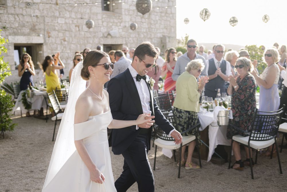 Bride and groom arriving to the reception at Fort George Vis